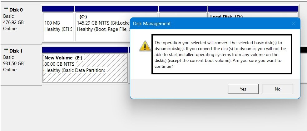 Disk Management warning dialog stating the basic disk will be converted to a dynamic disk if the operation continues.