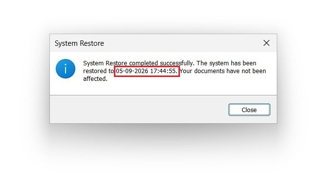 Windows 11 System Restore confirmation dialog showing that the system restore completed successfully